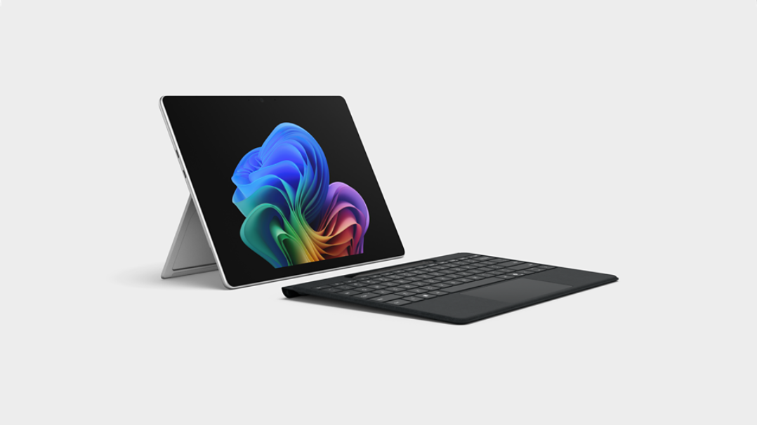 Un appareil Windows 11 Professionnel ouvert avec le clavier détaché affichant l'image de la fleur arc-en-ciel