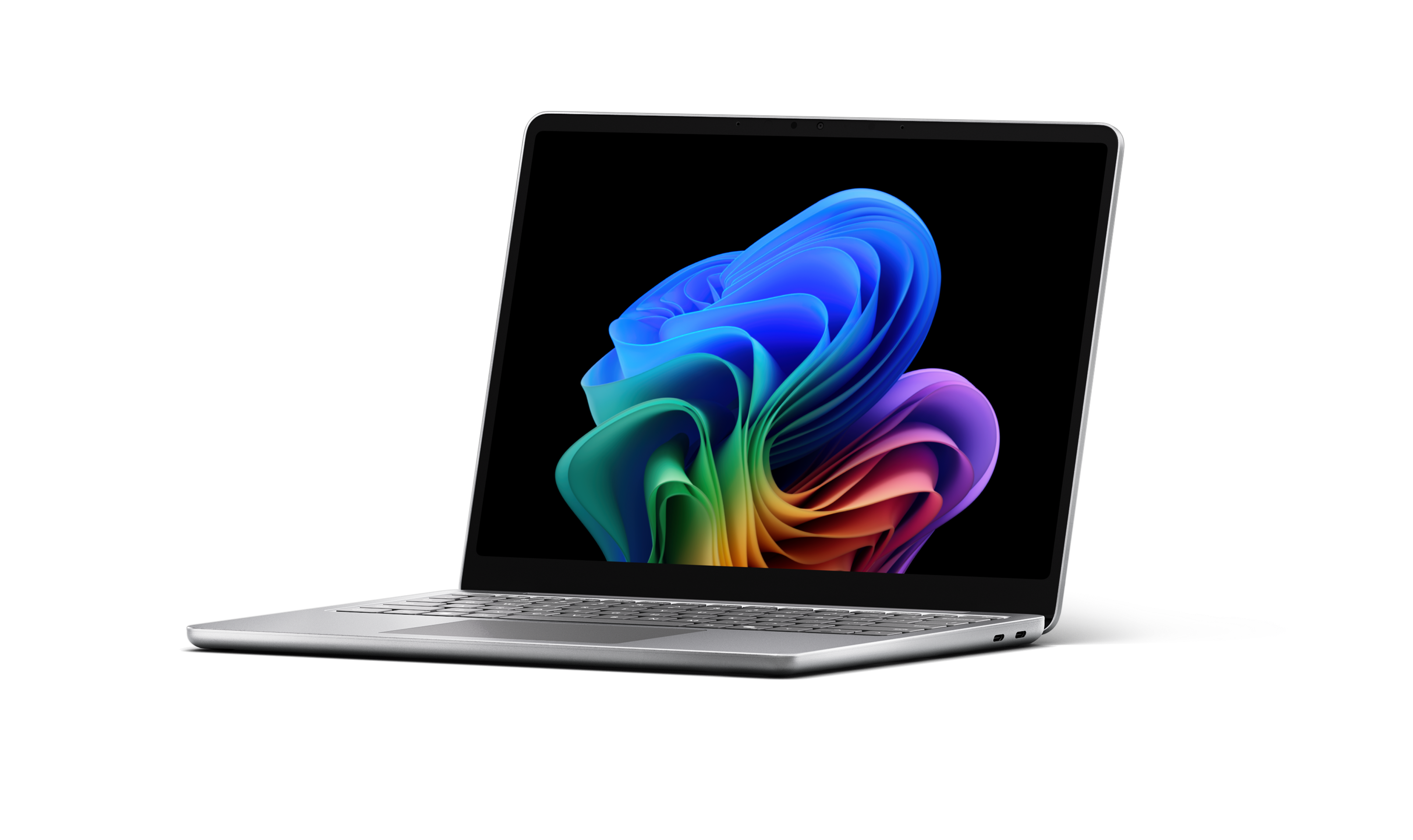 An open new generation Surface Laptop facing left displaying the rainbow bloom image