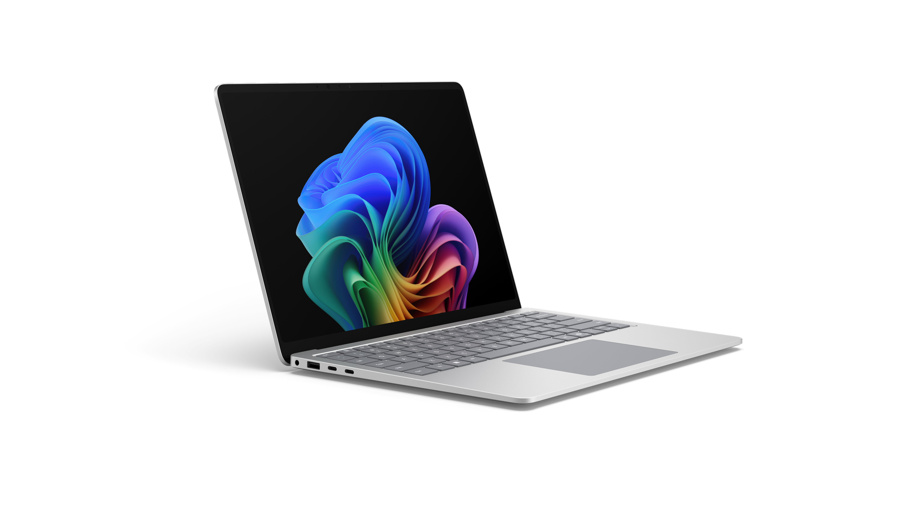Un Surface Laptop de nouvelle génération ouvert, tourné vers la droite, affichant l’image de l’arc-en-ciel en forme de fleur.