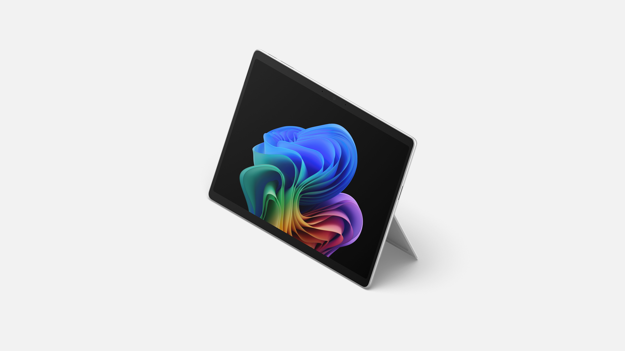 A Surface Pro for Business, 13-inch | Intel facing left without a keyboard displaying the rainbow bloom image.