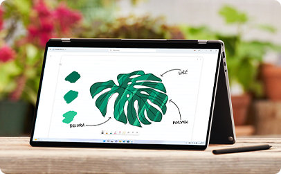 Otwarty laptop z rysunkiem liścia wyświetlonym na ekranie