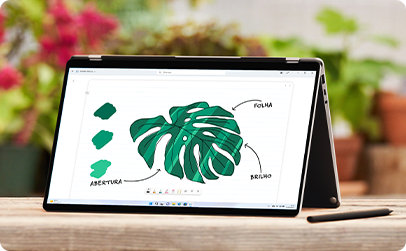 Portátil aberto com uma ilustração de uma folha no ecrã
