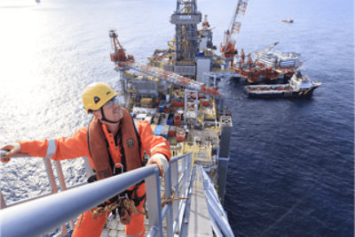 Workers on an oil rig in the ocean