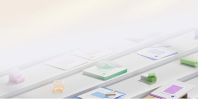 A close-up of several papers on a white shelf.