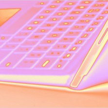 様式化されたノートパソコンの角とキーボードのクローズアップイラスト。