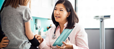 A woman holding a tablet.