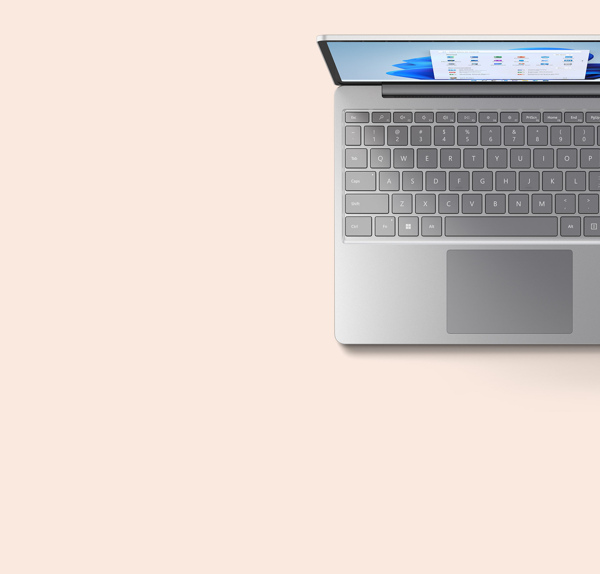 Bovenaanzicht van Surface Laptop Go 2 in platina toont het toetsenbord.