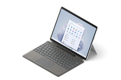 Surface Pro 9 shown from a side view with attached type cover and Surface Slim Pen 2.