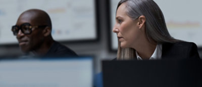 A man and woman looking at each other.