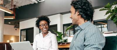 A man and woman smiling.