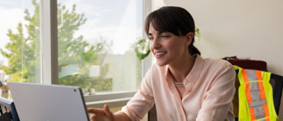 a woman smiling with her eyes closed
