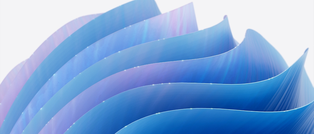 Abstraktní obrázek připomínající vlny v různých odstínech modré