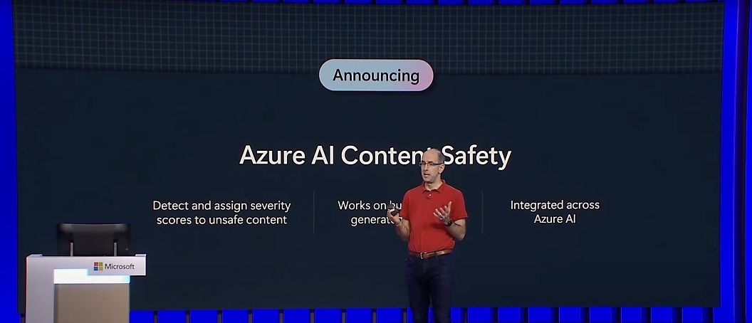 A person speaking in a conference for azure ai content safety