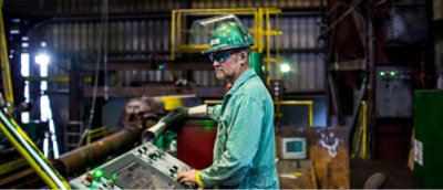 A man working in a machinery room