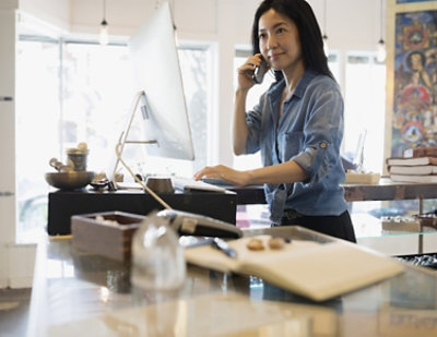 A woman talking on a cell phone.