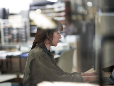 A person typing on a laptop