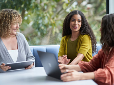 A group of people sitting around a table.