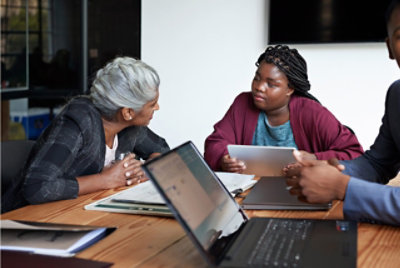 People having a conversation in a meeting