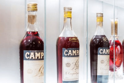Bottles of Campari in a glass case