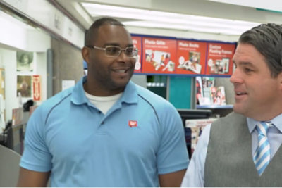 Two people having a conversation in a Walgreens