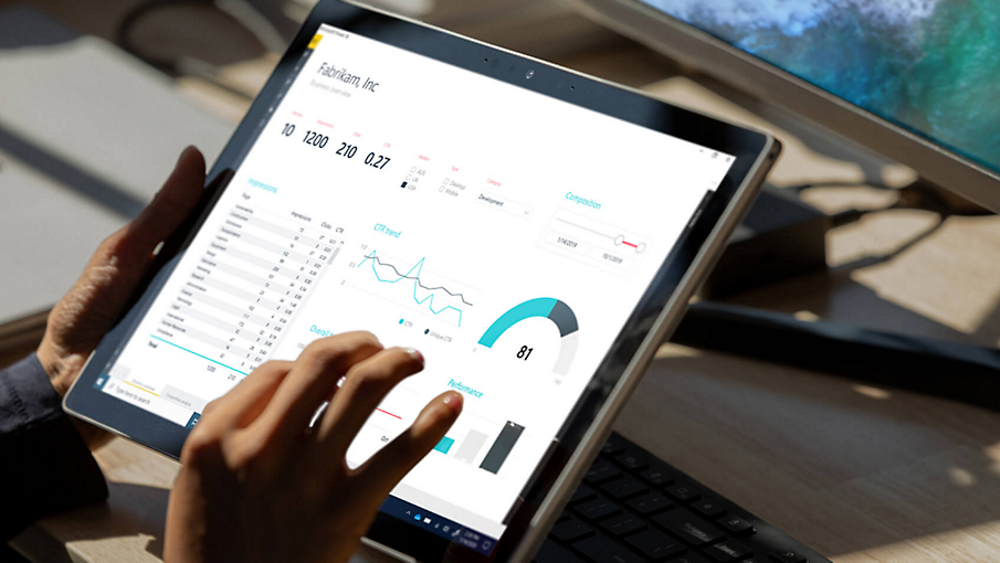 Hands on a tablet viewing analytics in Azure