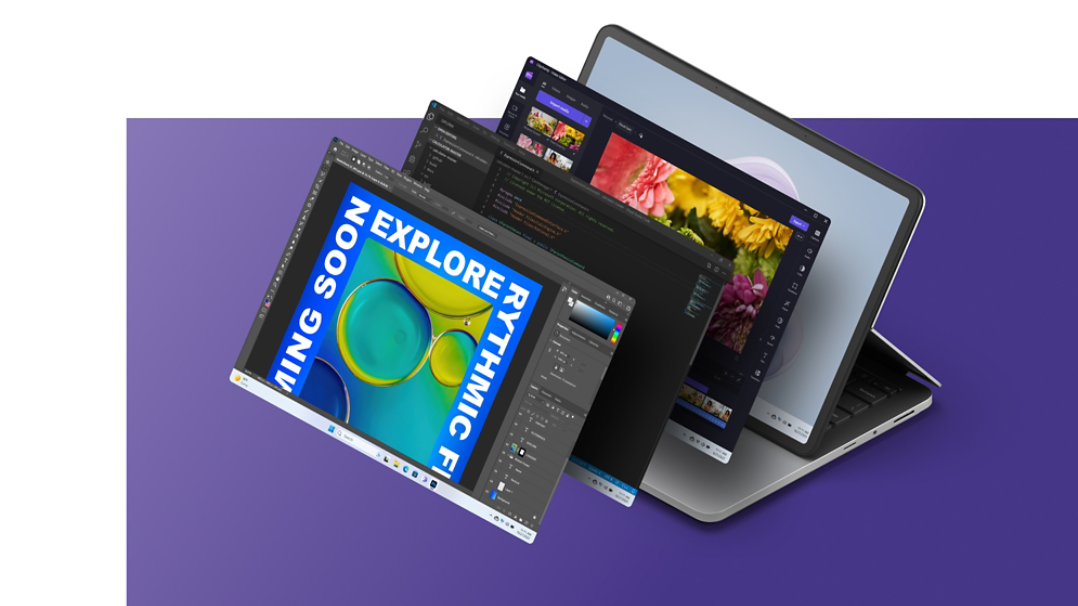 Surface Laptop Studio 2 الذي يعرض شاشة Windows bloom مع شاشات Clipchamp وVisual Studio وAdobe Photoshop مكدسة أمام الجهاز.