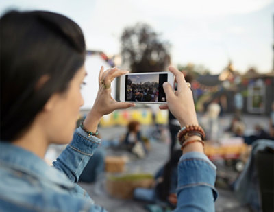 A woman taking a picture of herself.