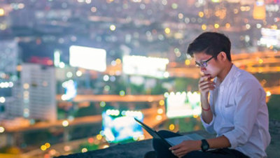 Sunset landscape with view of telco tower depicting cellular waves