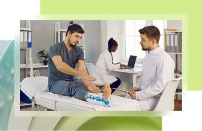 A man sitting on a bed with a patient.