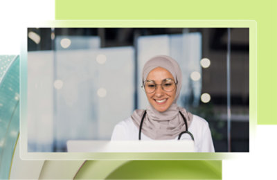 A woman wearing glasses and a headscarf.