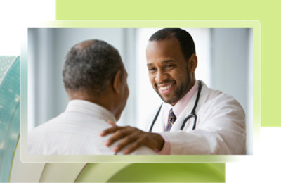 A doctor smiling with a patient.
