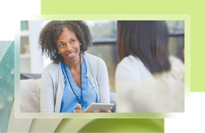A doctor checking the pulse of a patient.
