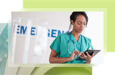 A woman in scrubs using a tablet.