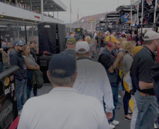 Crowd watching a NASCAR event.