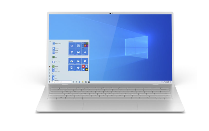 Silver laptop open displaying the Windows 10 start-up screen