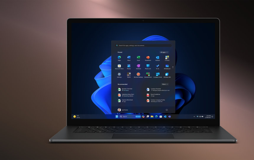 Laptop open to reveal Windows 11 startup screen.
