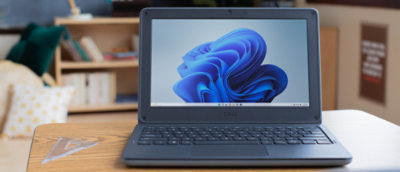 A laptop with a blue swirl on the screen.